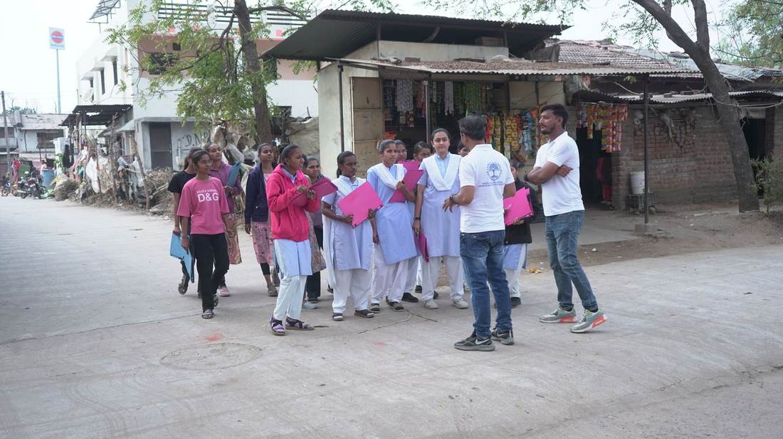 Foundation team briefing student interns ahead of a community outreach visit