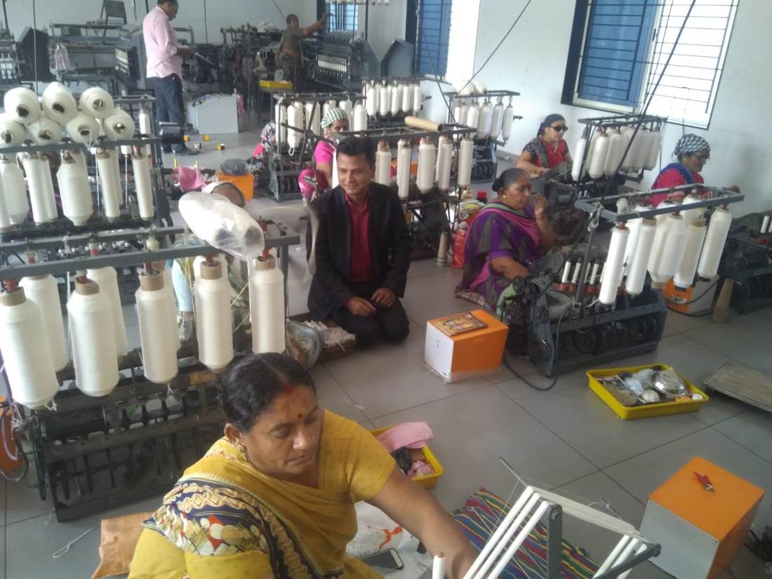 Workers at a textile and weaving livelihood unit