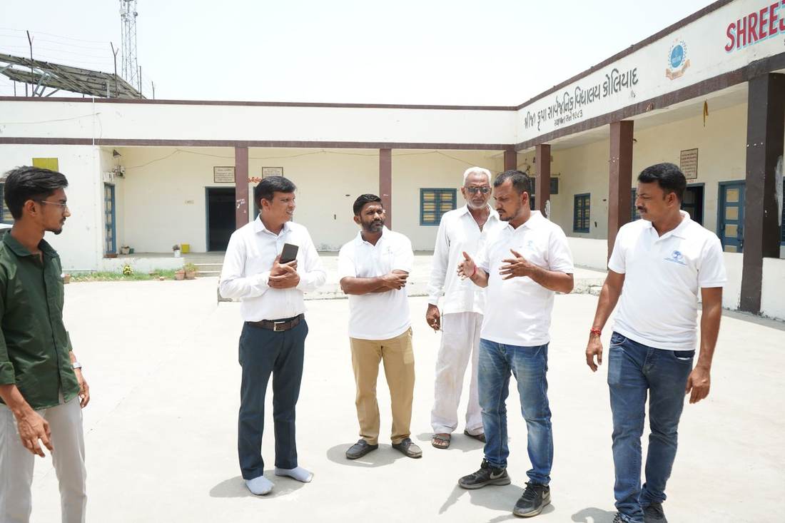 Foundation team and student interns assessing a government school building